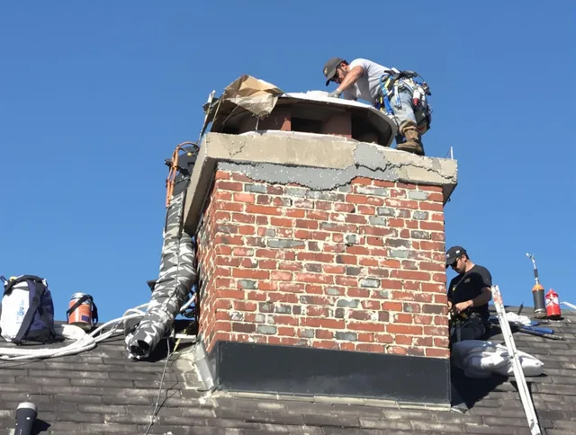 Granby Chimney Sweep installing a custom chimney crown in Granby, CT