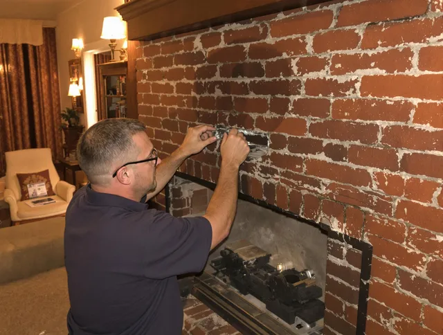 Granby Chimney Sweep expert fixing a fireplace in Granby, CT